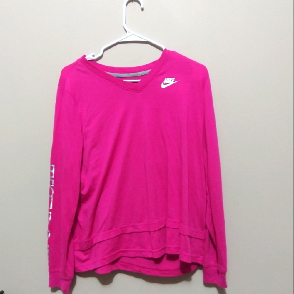 Nike pink long justice and the size is larg